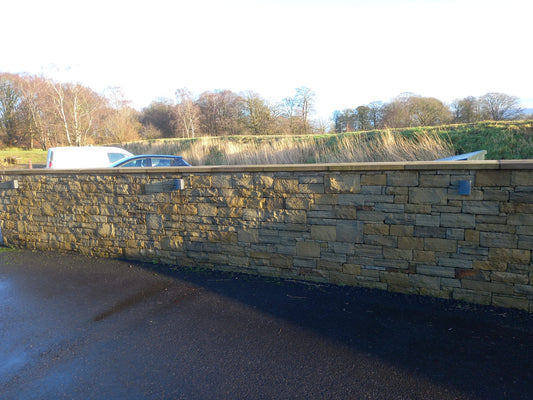 What are the different types of sandstone copings you can use when building a stone wall?